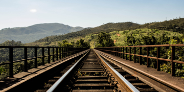 Train tracks heading into the mountains